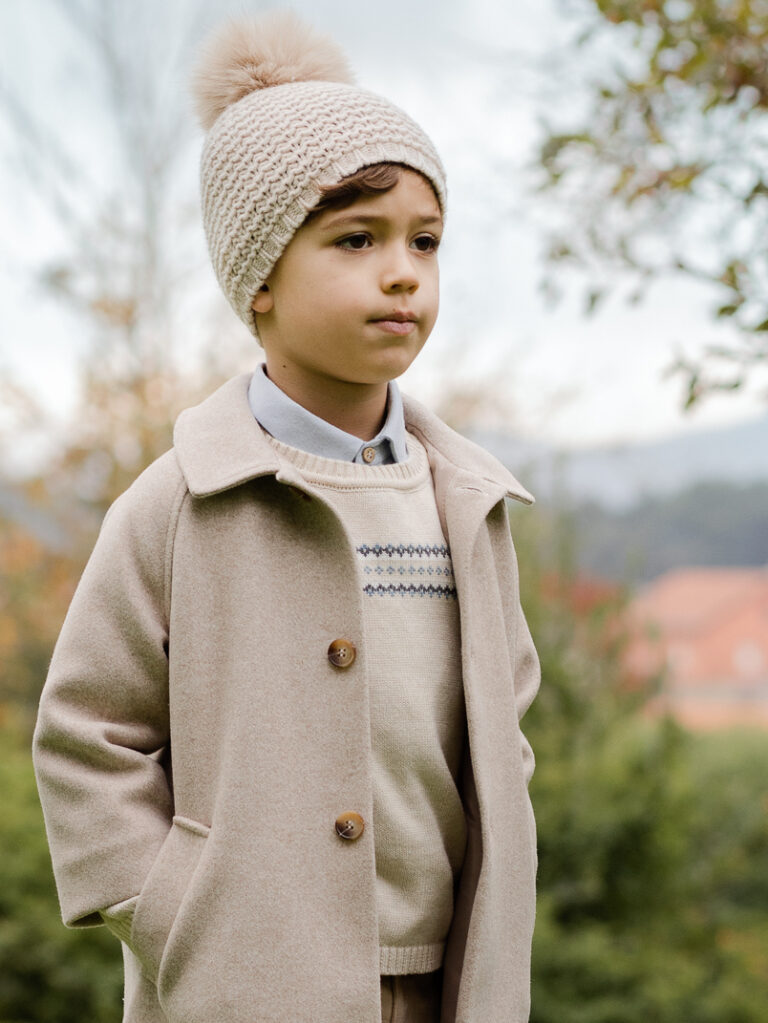 Beige Baby Boy's Cotton and Cashmere Sweater with Winter Patterns, worn by a child