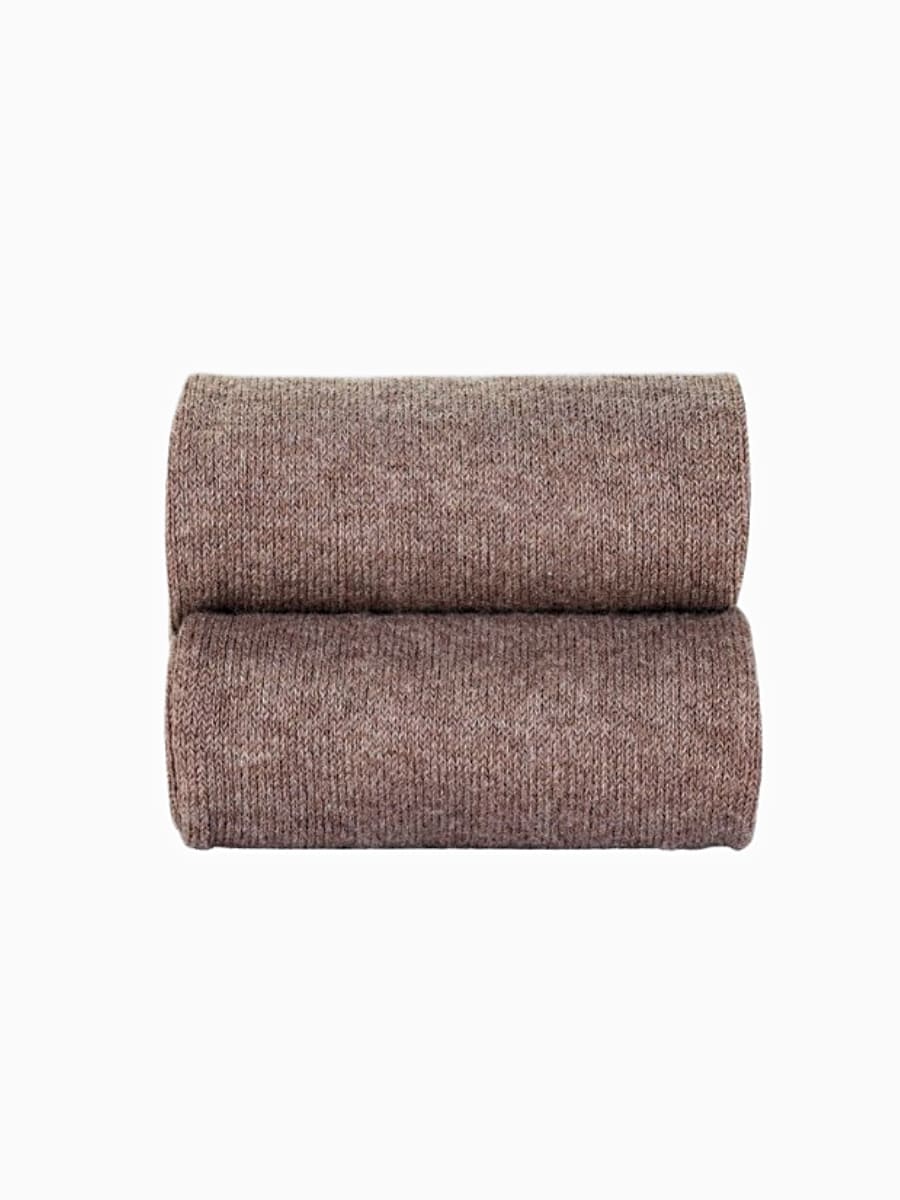 Détail du collant bébé uni de couleur taupe